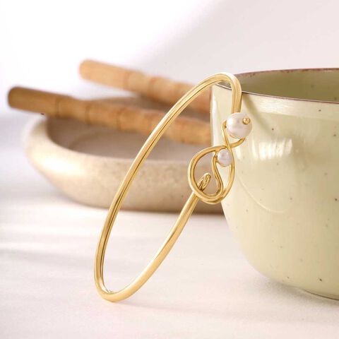Poised Knot Pearl Bangle