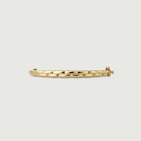 Elegant Twisted Gold Bangle