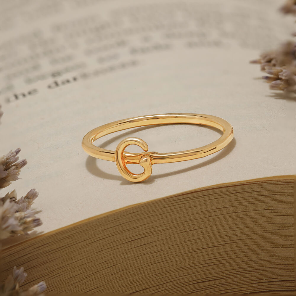 Gold ring with new arrivals letter g