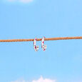 Playful Sculpted Silver Hoop Earrings,,hi-res view 1