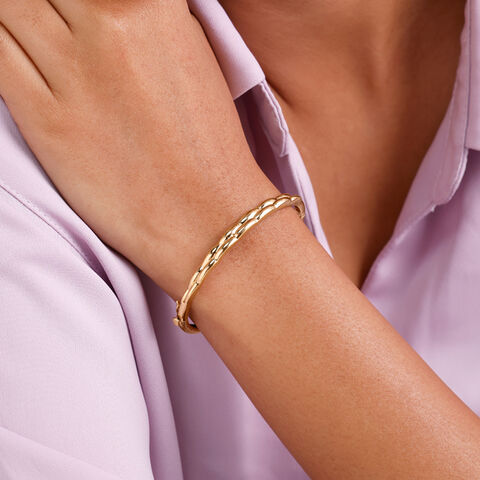 Elegant Twisted Gold Bangle
