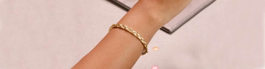 Elegant Twisted Gold Bangle