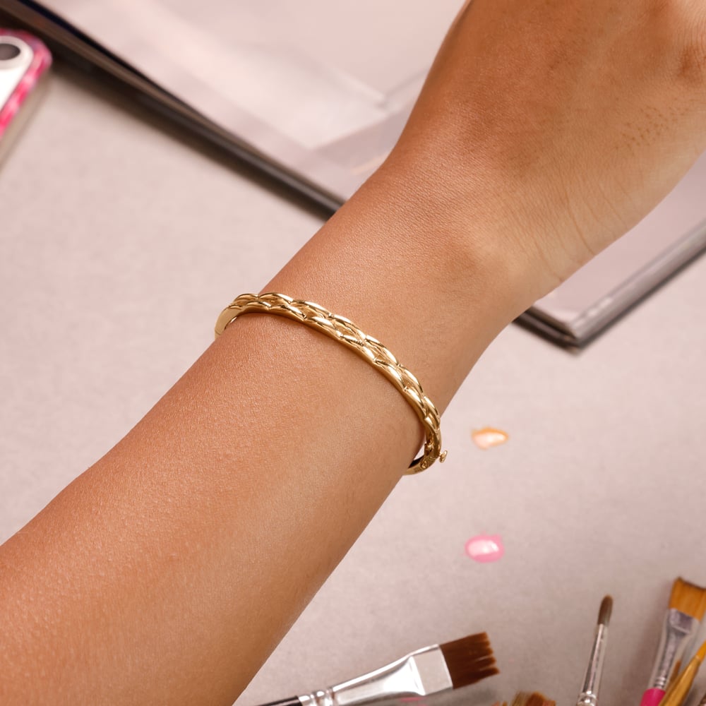 Elegant Twisted Gold Bangle