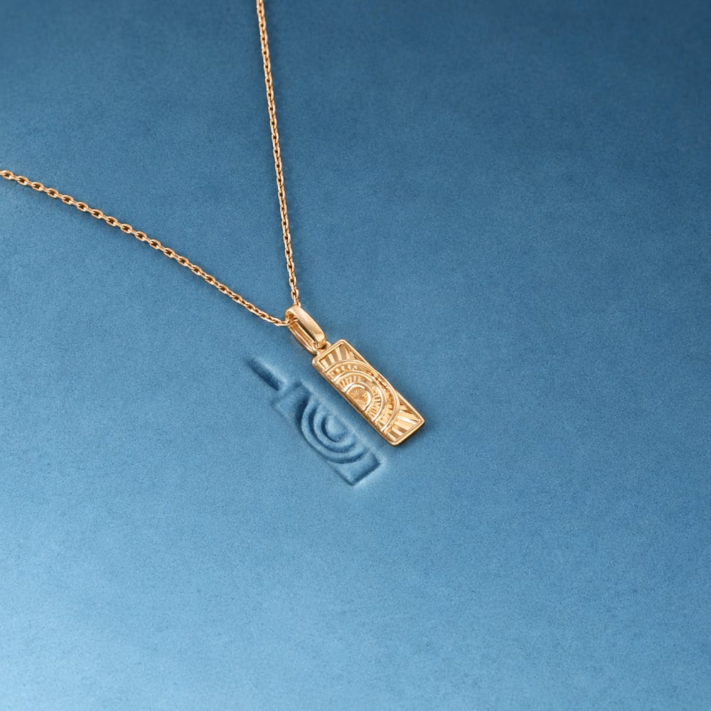 Intricate Radiant Gold Pendant