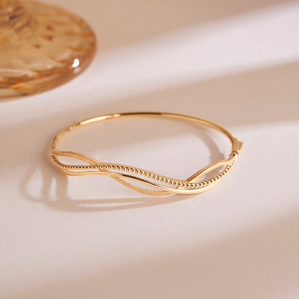 Sculpted Current Gold Bangle